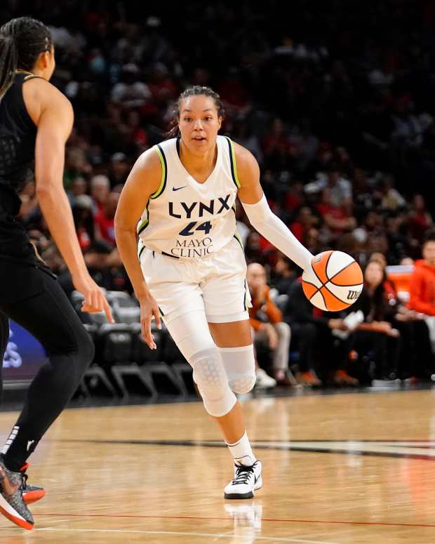 May 28, 2023; Las Vegas, Nevada, USA; Minnesota Lynx forward Napheesa Collier (24) dribbles the ball against Las Vegas Aces center Kiah Stokes (41) during the second quarter at Michelob Ultra Arena. Mandatory Credit: Lucas Peltier-USA TODAY Sports  