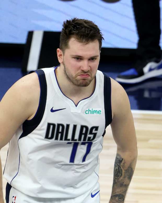 May 30, 2024; Minneapolis, Minnesota, USA; Dallas Mavericks guard Luka Doncic (77) reacts after a play during the second quarter in game five of the western conference finals for the 2024 NBA playoffs against the Minnesota Timberwolves at Target Center. Mandatory Credit: Jesse Johnson-USA TODAY Sports  
