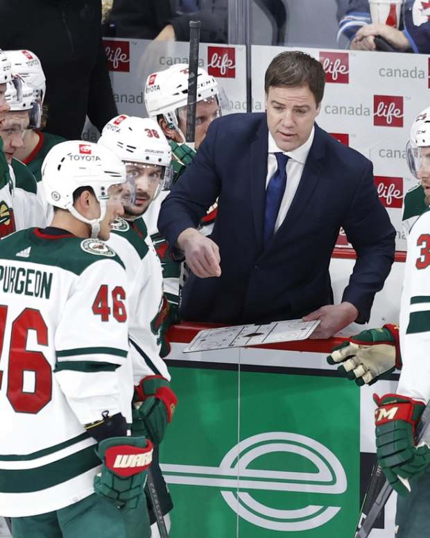 Feb 8, 2022; Winnipeg, Manitoba, CAN; Minnesota Wild Assistant Coach Darby Hendrickson plans out a play in the third period against the Winnipeg Jets at Canada Life Centre.