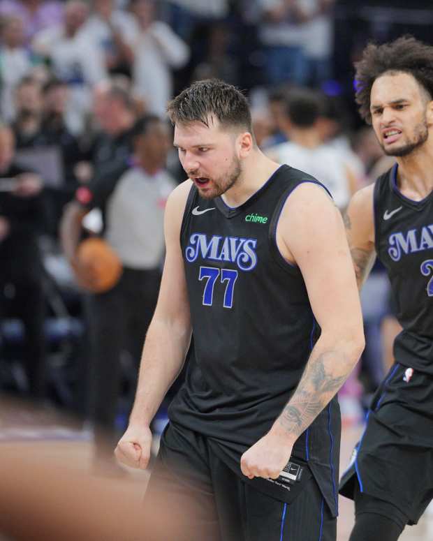 Dallas Mavericks guard Luka Doncic (77) and center Dereck Lively II (2) celebrate in the fourth quarter against the Minnesota Timberwolves