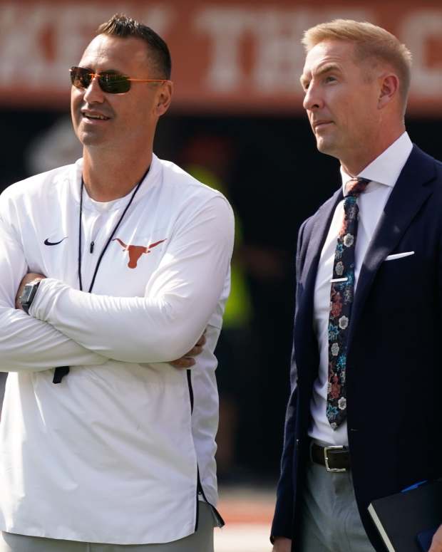 Sep 10, 2022; Austin, Texas, USA; Texas Longhorns head coach Steve Sarkisian talks with Fox Sports analyst Joel Klatt before the game against the Alabama Crimson Tide at Darrell K Royal-Texas Memorial Stadium.