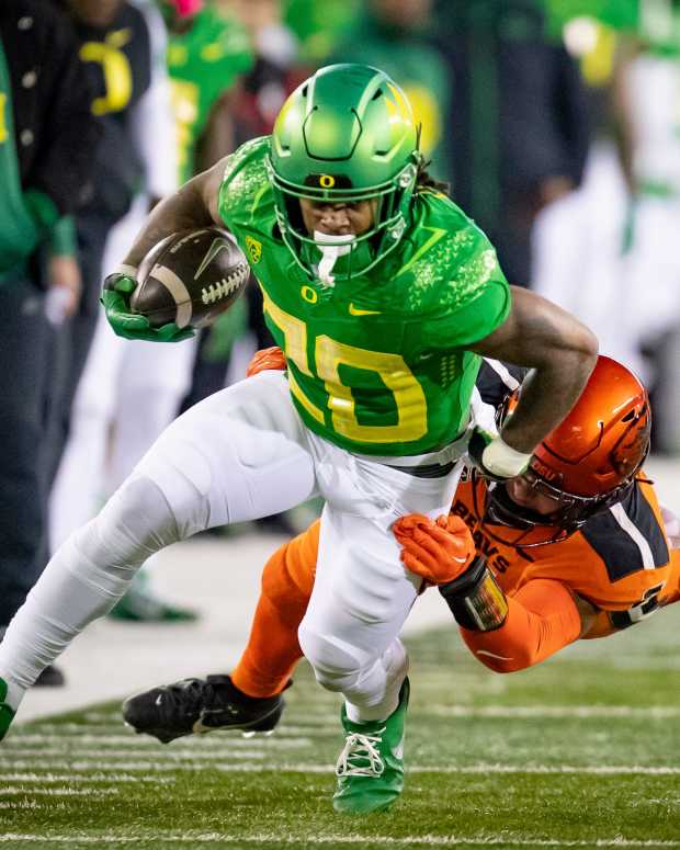 Oregon running back Jordan James carries the ball as the No. 6 Oregon Ducks take on the No. 16 Oregon State Beavers Friday, Nov. 24, 2023, at Autzen Stadium in Eugene, Ore.  