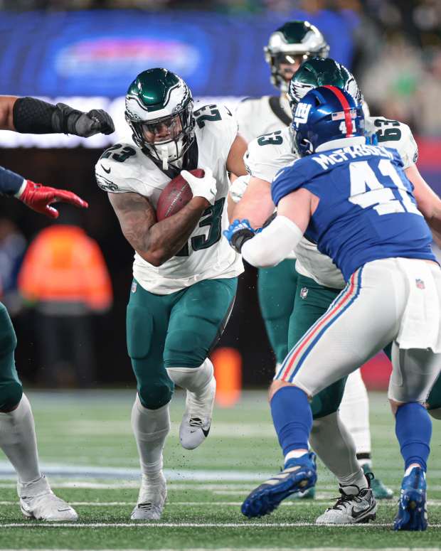 Philadelphia Eagles running back Rashaad Penny (23) carries the ball as New York Giants linebacker Micah McFadden (41) and linebacker Bobby Okereke (58) pursue during the second half at MetLife Stadium.