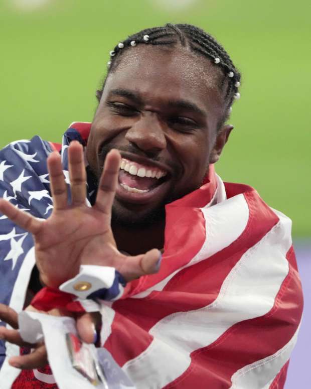 Noah Lyles reacts to Cole Hocker winning gold in the Men's 1500M at the Paris Olympics.