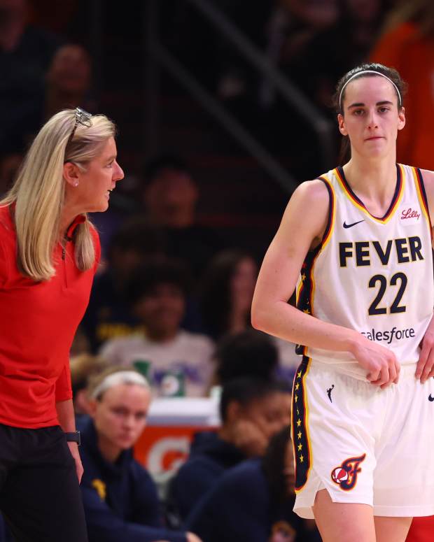 Indiana Fever head coach Christie Sides with guard Caitlin Clark (22)