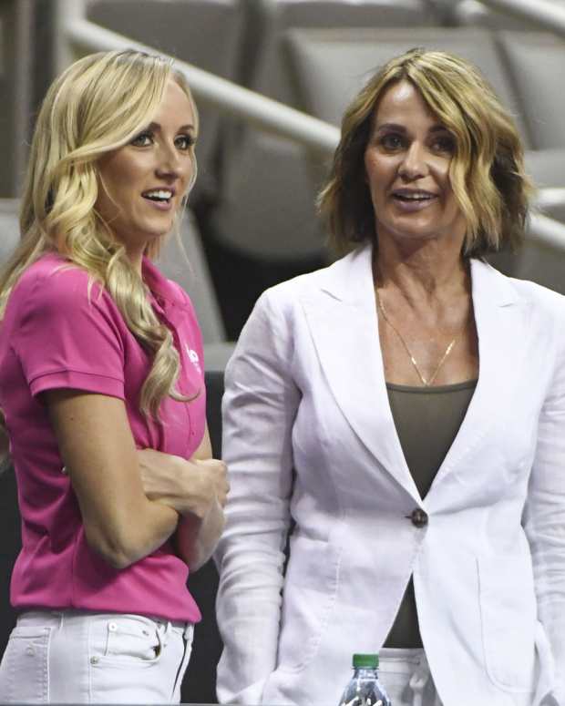 Nastia Liukin (left) and Nadia Comaneci (right) watch before the women's gymnastics U.S. Olympic team trials at SAP Center.