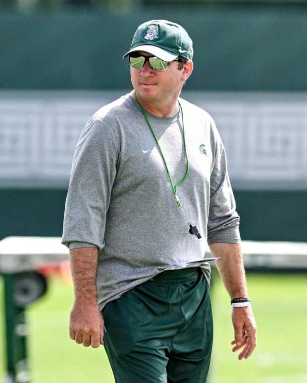 Michigan State's head coach Jonathan Smith watches over the action during the first day of football camp on Tuesday, July 30, 2024, in East Lansing - Nick King/Lansing State Journal / USA TODAY NETWORK