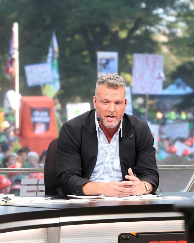 Host Pat McAfee, center, makes a point while Rece Davis, left, and Lee Corso look on during the ESPN College GameDay show on Saturday, Sept. 23, 2023, on the Hesburgh Library lawn on the University of Notre Dame campus in South Bend. The show was to highlight the Notre Dame-Ohio State game.  