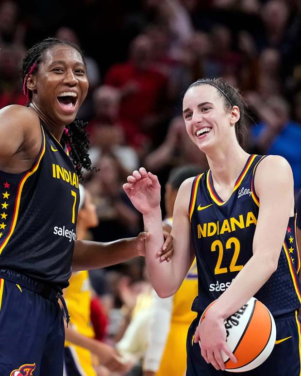 Indiana Fever forward Aliyah Boston (7) celebrates with Indiana Fever guard Caitlin Clark (22)