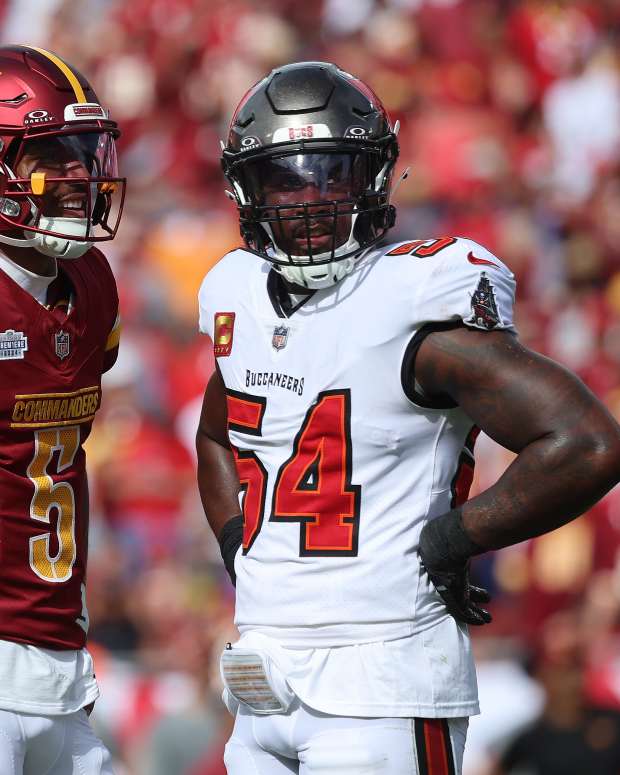 Sep 8, 2024; Tampa, Florida, USA; Washington Commanders quarterback Jayden Daniels (5) and Tampa Bay Buccaneers linebacker Lavonte David (54) look on during the first half at Raymond James Stadium.