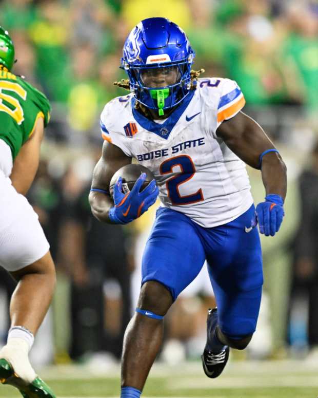 Sep 7, 2024; Eugene, Oregon, USA; Boise State Broncos running back Ashton Jeanty (2) picks up a first down during the second half against Oregon Ducks defensive lineman Derrick Harmon (55) at Autzen Stadium.