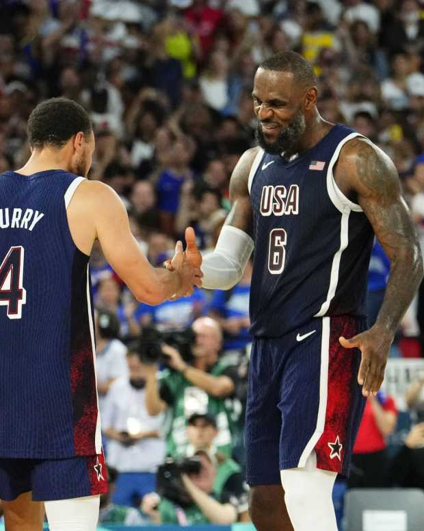 Paris, France; United States shooting guard Stephen Curry (4) and guard LeBron James (6) celebrate after defeating France in the men's basketball gold medal game during the Paris 2024 Olympic Summer Games at Accor Arena - Rob Schumacher-Imagn Images