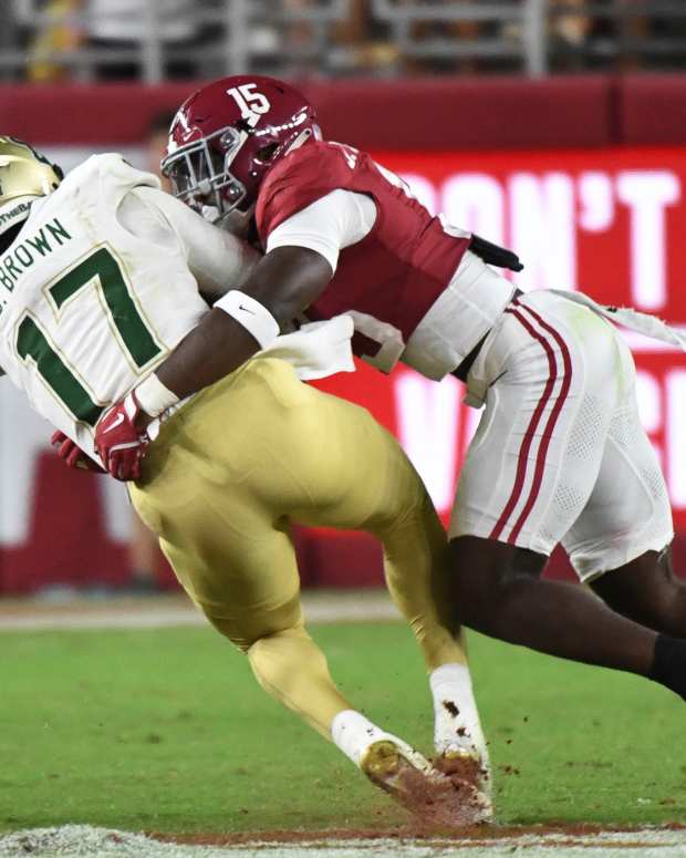 Alabama Crimson Tide linebacker Justin Jefferson (15) tackles South Florida Bulls quarterback Byrum Brown