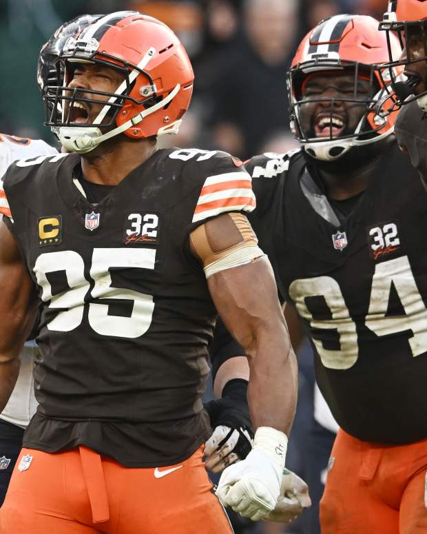 Dec 17, 2023; Cleveland, Ohio, USA; Cleveland Browns defensive end Myles Garrett (95) and defensive tackle Dalvin Tomlinson (94) and defensive end Alex Wright (91) celebrate after a tackle during the second half against the Chicago Bears at Cleveland Browns Stadium.