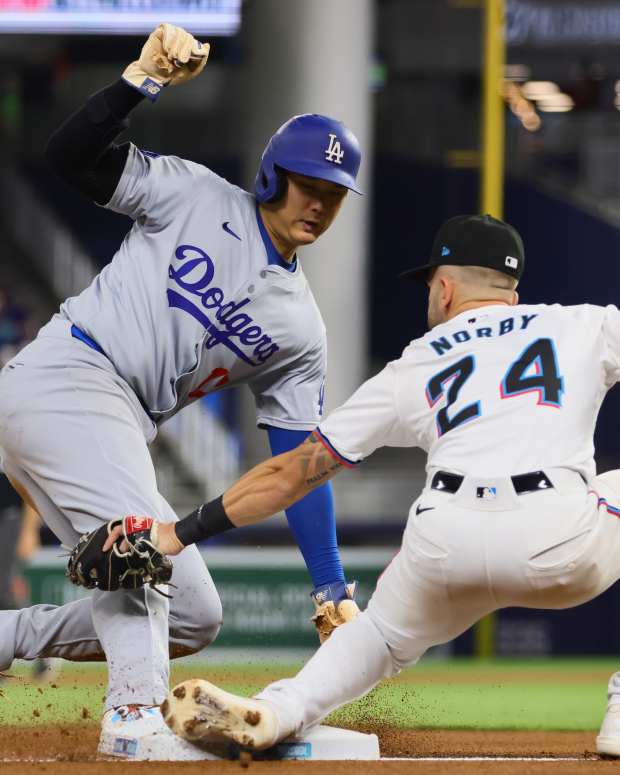 Sep 19, 2024; Miami, Florida, USA; Los Angeles Dodgers designated hitter Shohei Ohtani (17) steals third base against the Miami Marlins during the first inning at loanDepot Park.