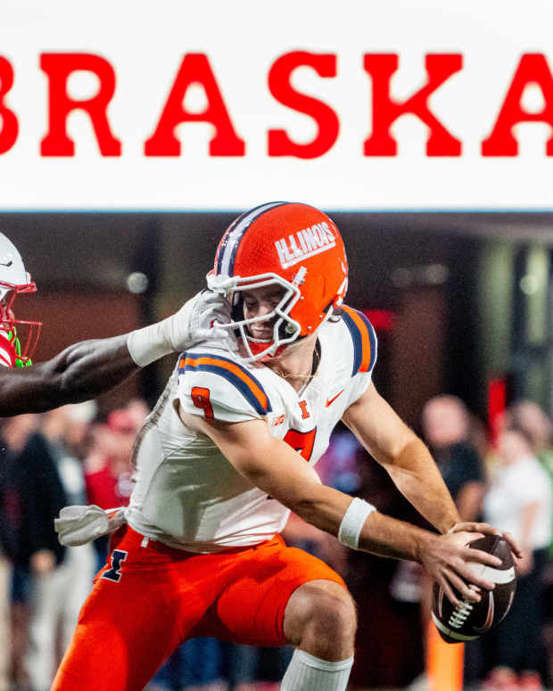 Sep 20, 2024; Lincoln, Nebraska, USA; Nebraska Cornhuskers defensive lineman Jimari Butler (1) grabs the face mask of Illinois Fighting Illini quarterback Luke Altmyer (9) during the second quarter at Memorial Stadium.