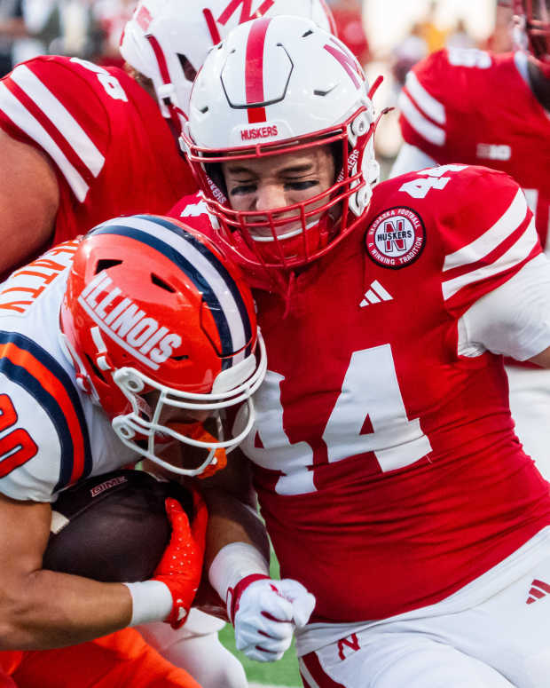 Sep 20, 2024; Lincoln, Nebraska, USA; Nebraska Cornhuskers defensive lineman Riley Van Poppel (44) hits Illinois Fighting Illini wide receiver Hank Beatty (80) on a punt return in the first quarter at Memorial Stadium.