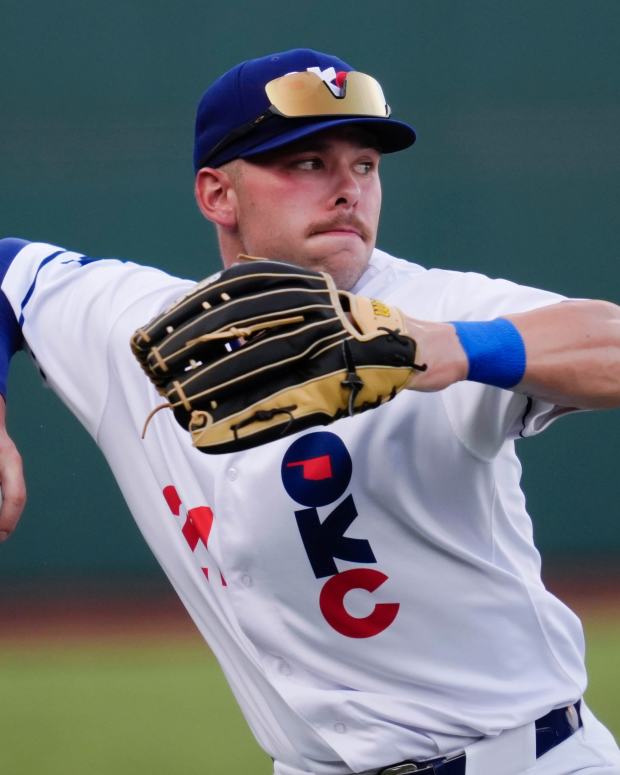 Oklahoma City's Dalton Rushing (21) throws to second during a baseball game between the Oklahoma City Baseball Club and the Round Rock Express at the Chickasaw Bricktown Ballpark in Oklahoma City, Wednesday, Aug. 7, 2024.