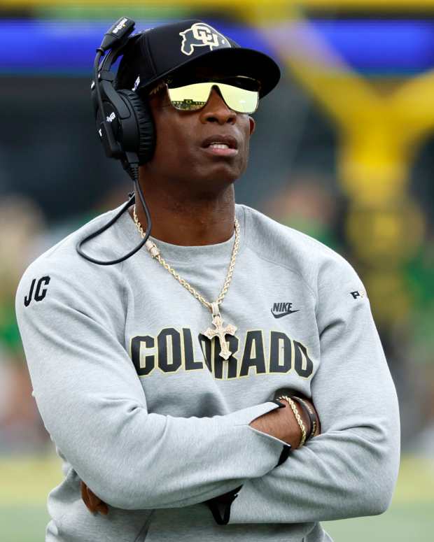 Sep 23, 2023; Eugene, Oregon, USA; Colorado Buffaloes head coach Deion Sanders watches the reply board during the first half against the Oregon Ducks at Autzen Stadium. Mandatory Credit: Soobum Im-USA TODAY Sports  