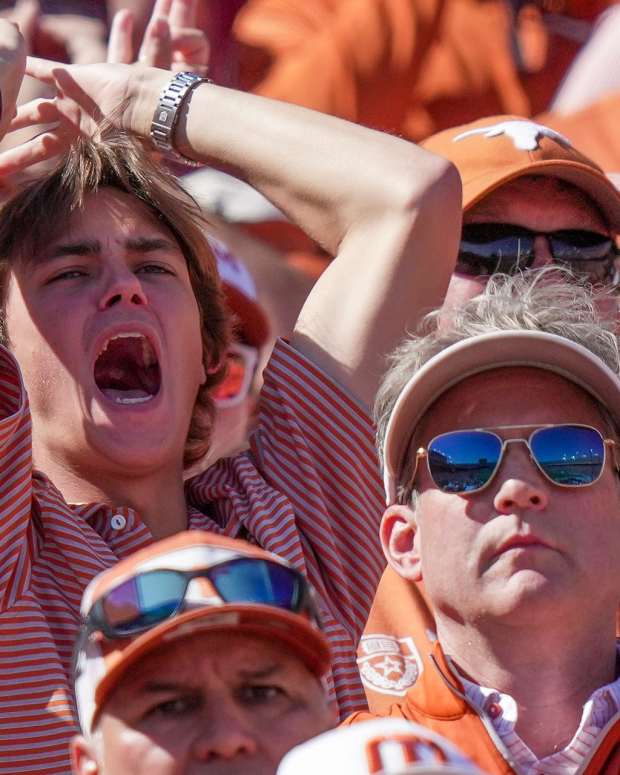 Texas Longhorns fans react to the game-winning touchdown from Oklahoma Sooners late in the fourth quarter during an NCAA college football game at the Cotton Bowl on Saturday, Oct. 7, 2023, in Dallas, Texas. This game makes up the 119th rivalry match-up. Oklahoma Sooners beat Texas Longhorns 34-30.