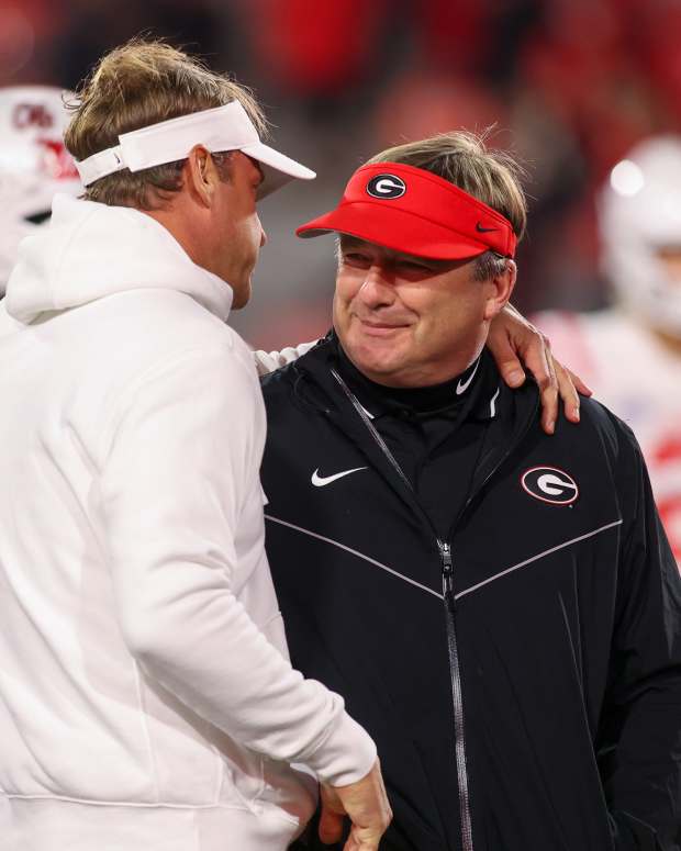 Nov 11, 2023; Athens, Georgia, USA; Mississippi Rebels head coach Lane Kiffin talks to Georgia Bulldogs head coach Kirby Smart before a game at Sanford Stadium.