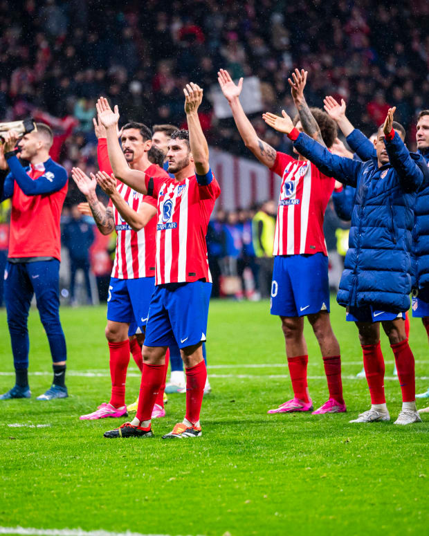 Atletico Madrid players pictured celebrating in front of their fans after beating Real Madrid 4-2 in the Copa del Rey in January 2024