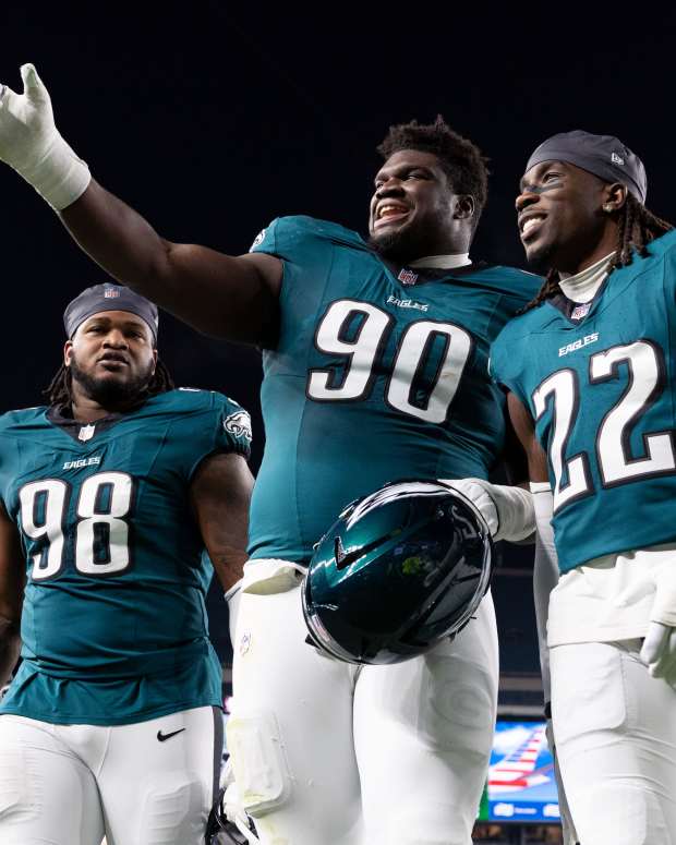 Philadelphia Eagles defensive tackle Jalen Carter (98) and defensive tackle Jordan Davis (90) and cornerback Kelee Ringo (22)