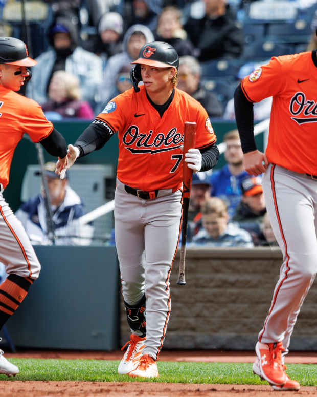 Baltimore Orioles second baseman Jackson Holliday (7) reacts with outfielder Tyler O'Neill (9)