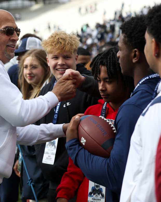 Apr 26, 2025; University Park, PA, USA; Penn State Nittany Lions head coach James Franklin interacts with recruits following the Blue White spring game at Beaver Stadium. The White team defeated the Blue team 10-8.