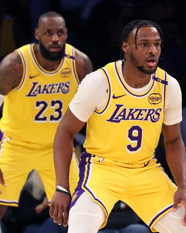 LeBron James and Bronny James of the Los Angeles Lakers defend during their game against the Minnesota Timberwolves at Crypto.com Arena on October 22, 2024.