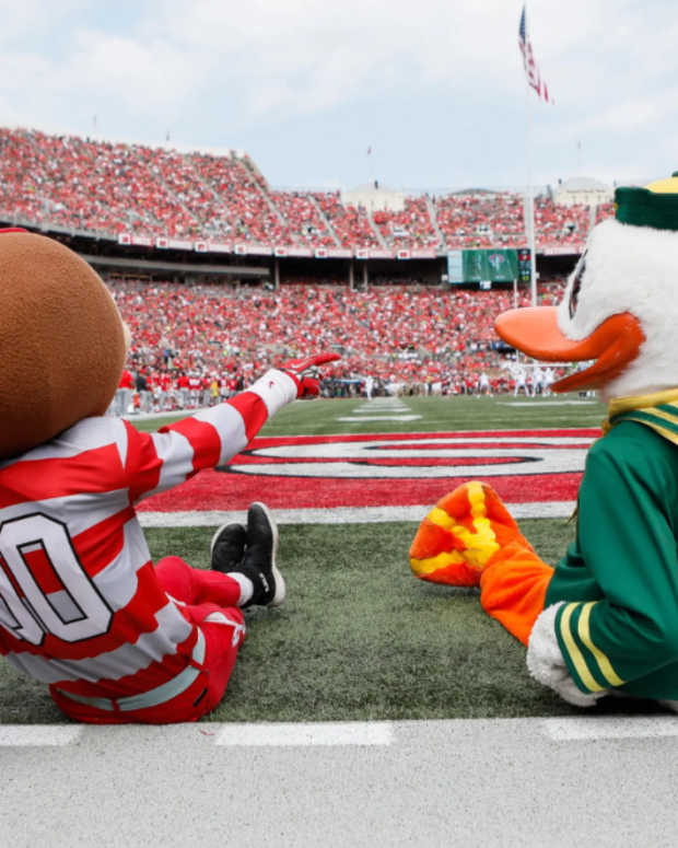 Brutus Buckeye and the Oregon Ducks mascot watch from the sideline during the first half of the NCAA football game at Ohio Stadium in Columbus on Saturday, Sept. 11, 2021.  Oregon Ducks At Ohio State Buckeyes Football