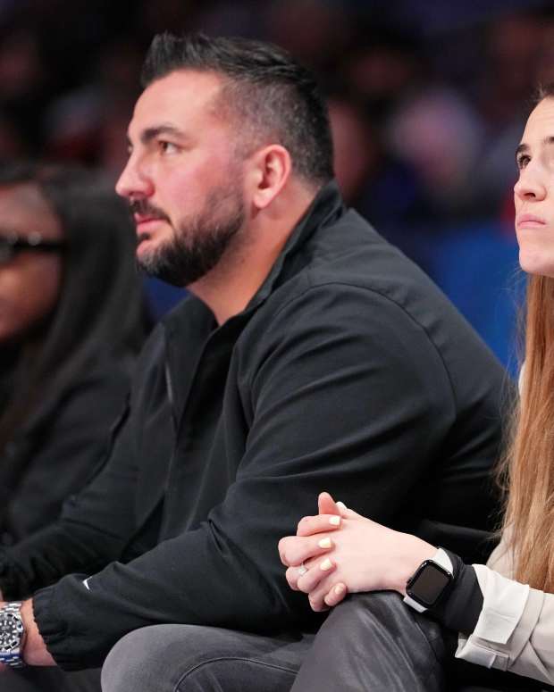  New York Liberty guard Sabrina Ionescu and Las Vegas Raiders offensive lineman Hroniss Grasu look on during the second half of the 73rd NBA All Star game at Gainbridge Fieldhouse. Mandatory Credit: Kyle Terada-Imagn Images