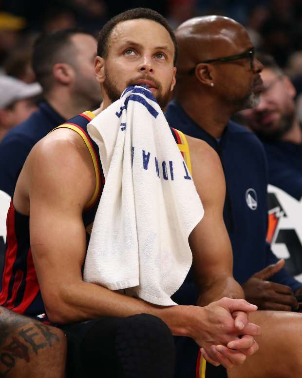 Dec 19, 2024; Memphis, Tennessee, USA; Golden State Warriors guard Stephen Curry (30) looks on from the bench during the second quarter against the Memphis Grizzlies at FedExForum. Mandatory Credit: Petre Thomas-Imagn Images