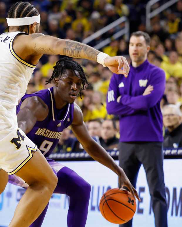 Jan 12, 2025; Ann Arbor, Michigan, USA; Washington Huskies guard Zoom Diallo (9) dribbles on Michigan Wolverines guard Roddy Gayle Jr. (11) in the second half at Crisler Center.