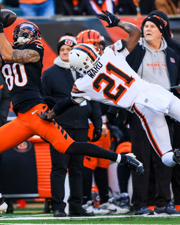 Dec 22, 2024; Cincinnati, Ohio, USA; Cincinnati Bengals wide receiver Andrei Iosivas (80) catches a pass against Cleveland Browns cornerback Denzel Ward (21) in the second half at Paycor Stadium.