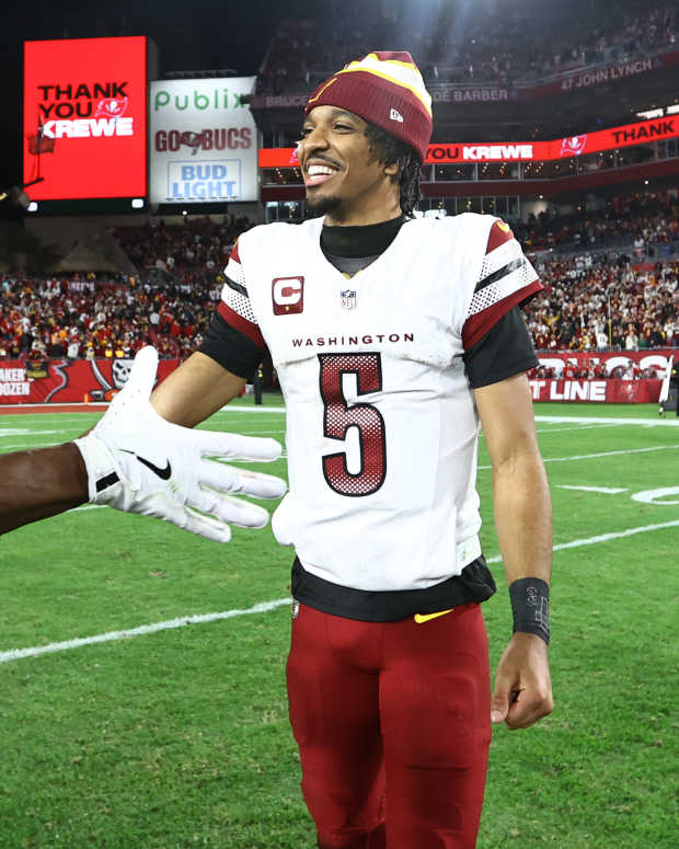 Jayden Daniels celebrates with Terry McLaurin after the Commanders' win at Tampa Bay.