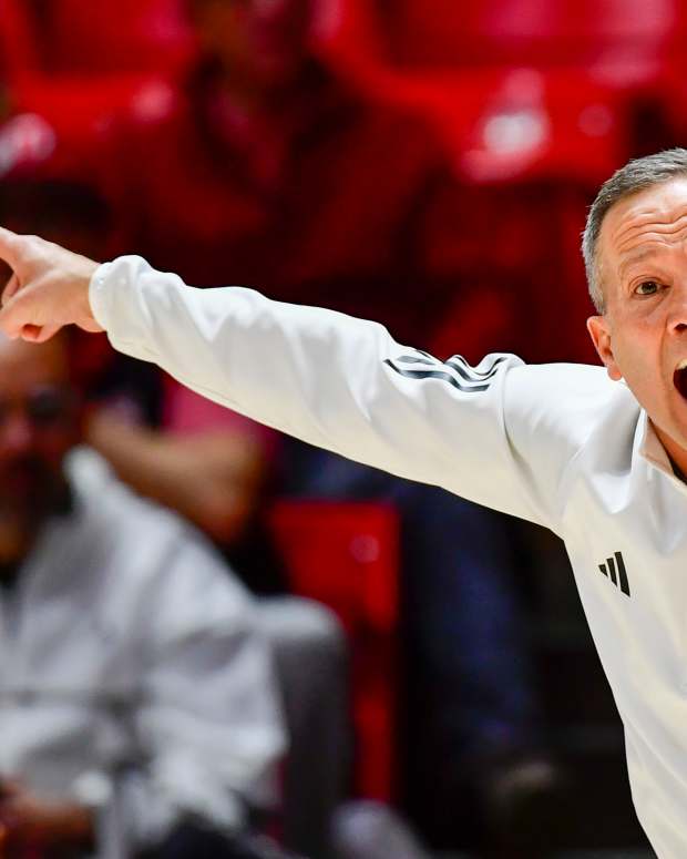 Jan 4, 2025; Salt Lake City, Utah, USA; Texas Tech Red Raiders head coach Grant McCasland makes a call during the second half against the Utah Utes at the Jon M. Huntsman Center.