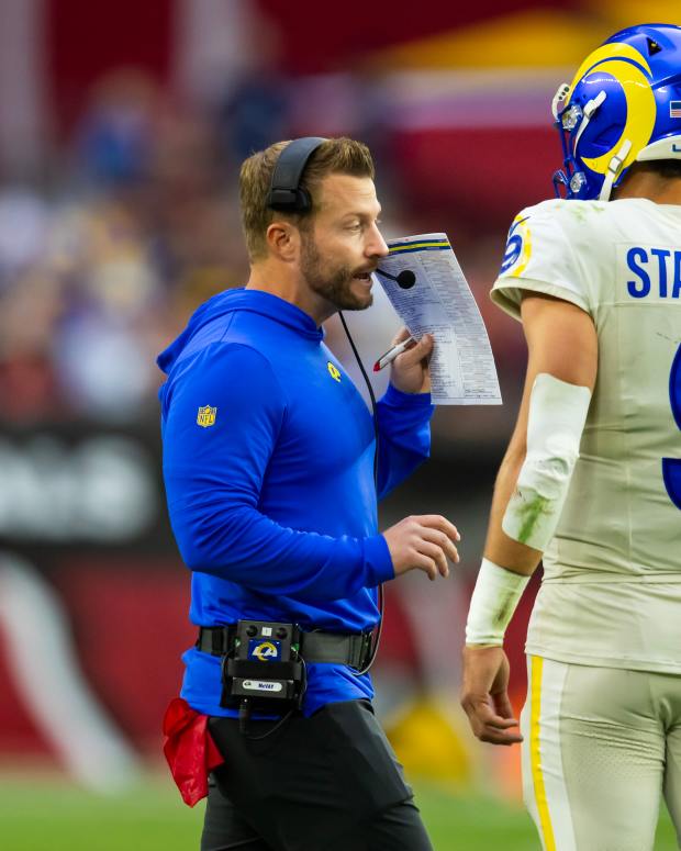 Los Angeles Rams coach Sean McVay talks with quarterback Matthew Stafford.