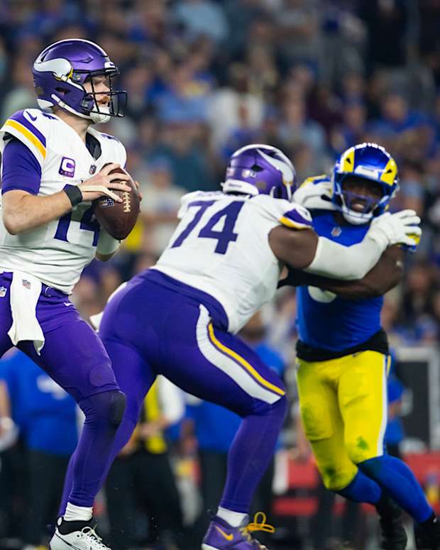 Jan 13, 2025; Glendale, AZ, USA; Minnesota Vikings quarterback Sam Darnold (14) against the Los Angeles Rams during an NFC wild card game at State Farm Stadium. 