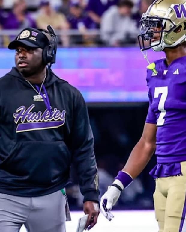 Washington assistant defensive backs coach and assistant director of recruiting Armond Hawkins Jr. on field during the 2024 season opener against Weber State.