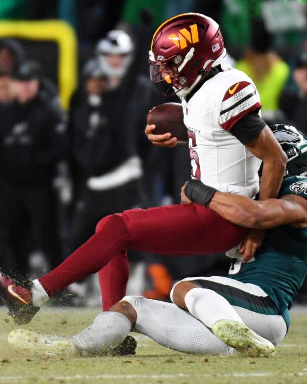 Philadelphia Eagles linebacker Nolan Smith Jr. (3) sacks Washington Commanders quarterback Jayden Daniels (5).