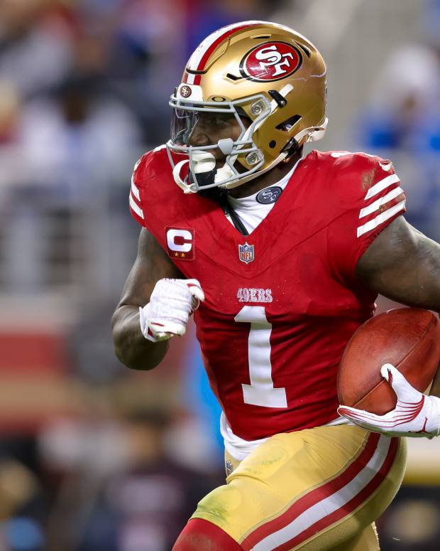 Deebo Samuel of the 49ers totes the football as he races down the field.