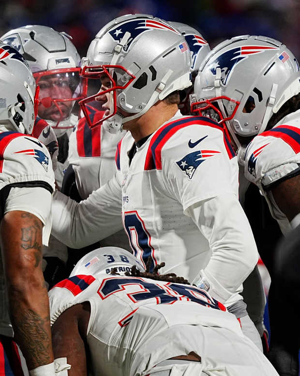 New England Patriots quarterback Drake Maye (10) talks to his offensive line in the huddle during second half action at Highmark Stadium where the Buffalo Bills hosted the New England Patriots in Orchard Park on Dec. 22, 2024.