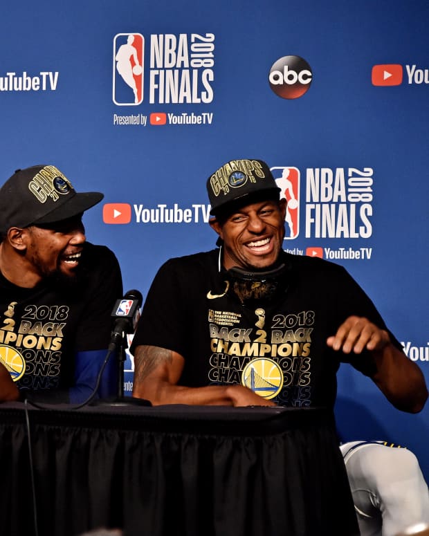 Jun 8, 2018; Cleveland, OH, USA; Golden State Warriors forward Draymond Green (23), forward Kevin Durant (35) and forward Andre Iguodala (9) speak during a press conference after beating the Cleveland Cavaliers in game four of the 2018 NBA Finals at Quicken Loans Arena. Mandatory Credit: Ken Blaze-Imagn Images