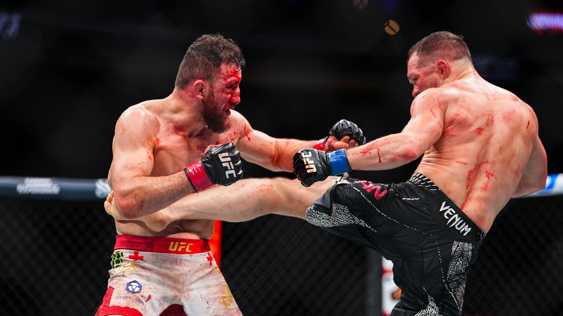 Petr Yan and Merab Dvalishvili trading strikes in their December 2025 UFC 323 rematch