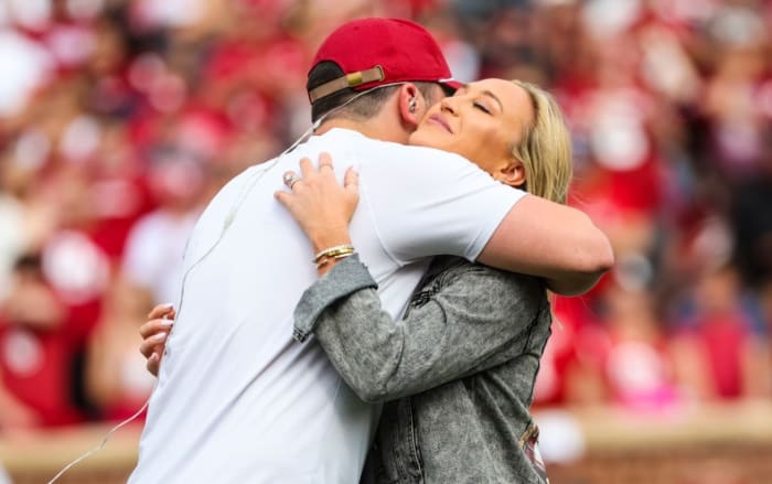 Emily and Baker Mayfield embrace.