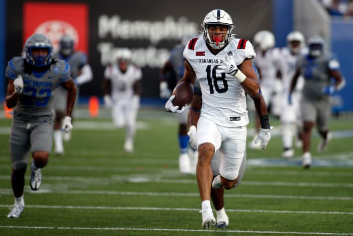 Memphis, Tennessee, USA; Arkansas State Red Wolves tight end Seydou Traore (18) runs after catching for a touchdown in the first half against the Memphis Tigers at Liberty Bowl Memorial Stadium.