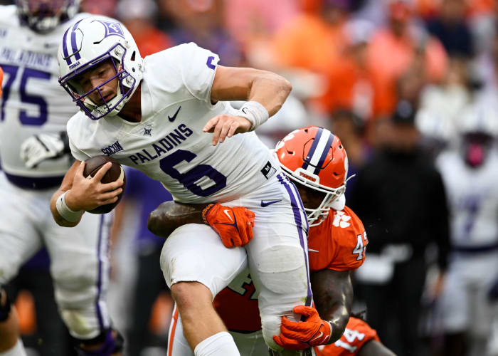CLEMSON, SOUTH CAROLINA - SEPTEMBER 10: Furman Paladins' Tyler Huff #6 is tackled by Clemson Tigers LaVonta Bentley #42 during the third quarter at Memorial Stadium on September 10, 2022 in Clemson, South Carolina.  (Photo by Eakin Howard/Getty Images)