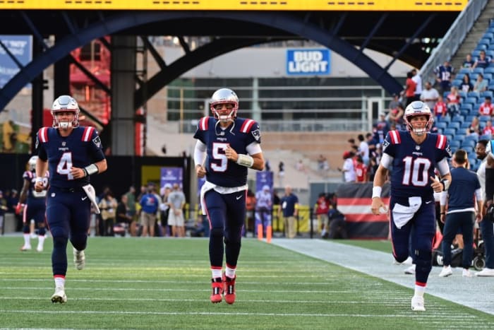 Patriots quarterbacks Bailey Zappe, Brian Hoyer and Mac Jones.