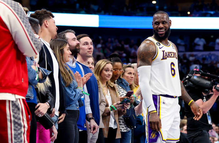 Feb 26, 2023; Dallas, Texas, USA; Los Angeles Lakers forward LeBron James (6) laughs with Kansas City Chiefs quarterback Patrick Mahomes during the fourth quarter against the Dallas Mavericks at American Airlines Center.
